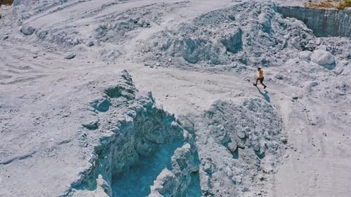 Active runner jogging outdoor. Aerial view of athletic young man running in the nature