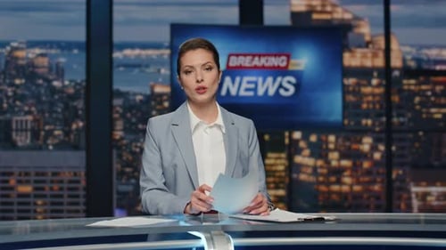 Female News Anchor Reporting Breaking News in Studio