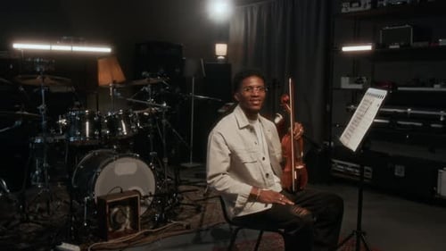 Young Adult Violinist Poses in Studio