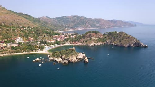 Drone shot of the Isola Bella coastline with the Ionian Sea. Near Taormina, Sicily, southern Italy.