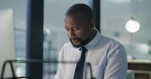 Stress, tired and night with black man in office for anxiety, headache and burnout