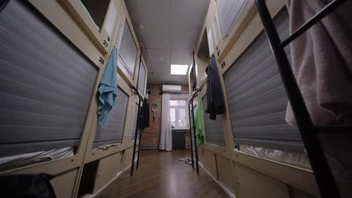 Hostel Room with Capsule Beds Offering Privacy and Comfort