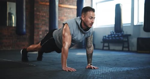 Fitness, push up and challenge with man in gym for workout, health and power