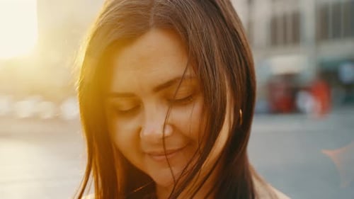 Portrait of a Happy Young Girl Relaxing Outdoors in the City