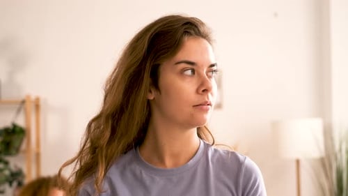 Smiling Young Woman Looking at Camera