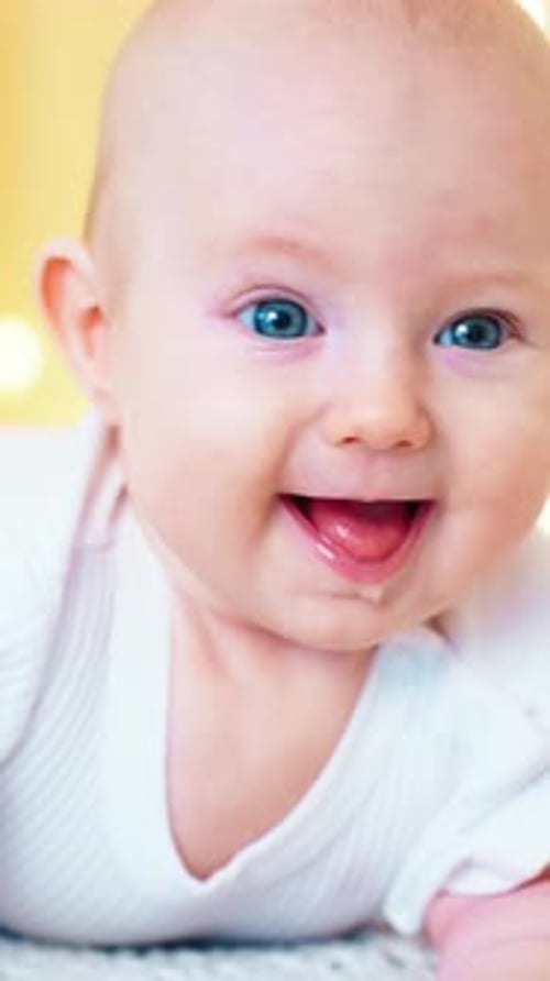 Smiling Infant Sticks Out Tongue