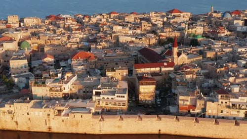 Acre old city port houses and Mosque at sunrise, Aerial view