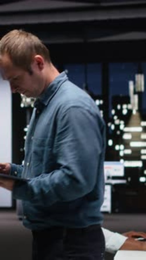 Vertical Video Manager in Office Analyzes Machine Learning Algorithms Built By Workers