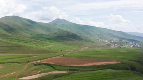 Aerial footage cultivated lands. Village town near Hatis mountain in Armenia, Caucasus.