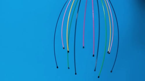 Colorful Head Massager on Blue Background