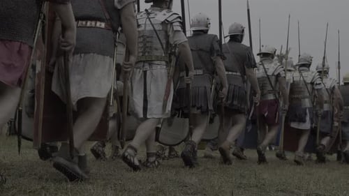 Historical Soldiers Marching Across Green Grass