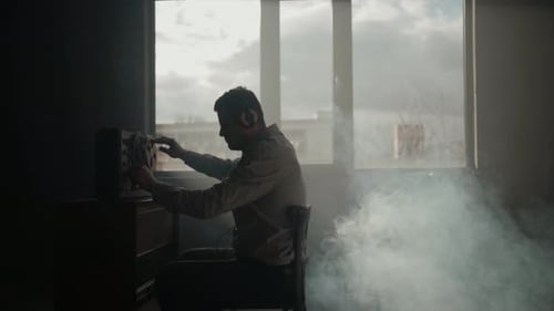 Man Working with Vintage Reel to Reel Recorder