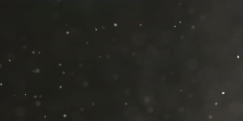 Partikel fliegen auf dunklem Hintergrund