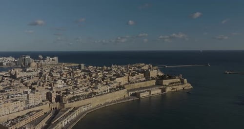 Aerial view of historic Valletta with Mediterranean Sea coastline, Malta.