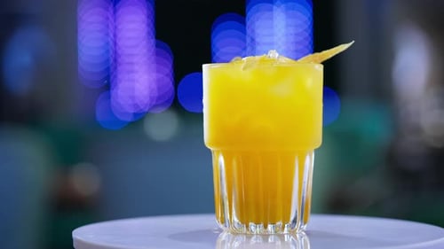 Refreshing Yellow Drink with Lemon at Night