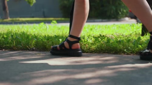 Female Pedestrian Ambles Slowly Amidst Tranquil City Surroundings Lady with Umbrella Moves Gradually
