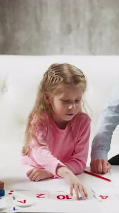 Little Girl Shows Digit Seven Near Boy at Online Lesson