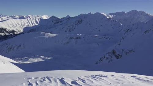 Panorama of Winter Alps Mountains Landscape in Sunny Frozen Nature