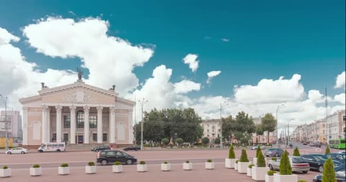 The Majestic Architecture Contrasts with the Scenic Sky Above the Vibrant City Square Enhancing
