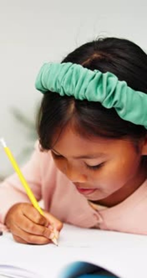 Child, home and learning with writing, paper and pencil for studying, improvement and homework