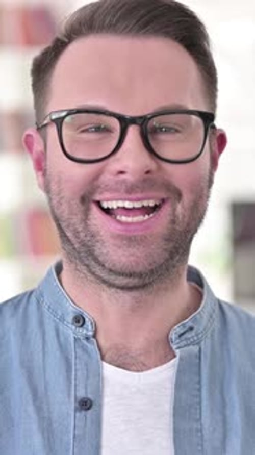 Smiling Man with Glasses Portrait Close-Up in Home