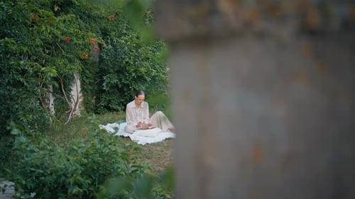 Woman Reading Romantic Literature at Blanket in Green Garden Girl Enjoy Novel