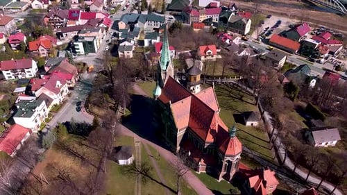 Aerial shot of huge old church located in the small town