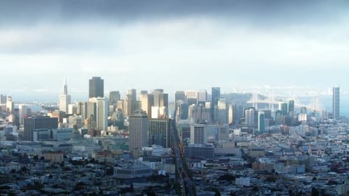 Golden San Francisco skyline time lapse from twin peaks at sunset