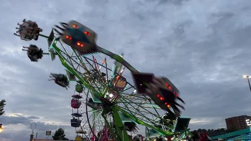Amusement Park Roller Coaster and Ferris Wheel at Sunset in Dartmouth Canada