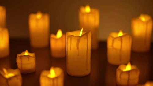 Glowing Candles Flicker Gently in the Dark