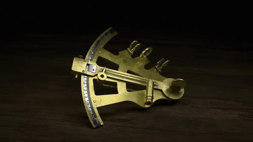 An Antique Nautical Sextant On An Old Wooden Table 2