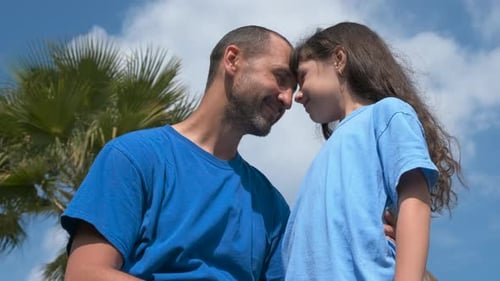 Loving Father and Daughter Embrace in Tropics