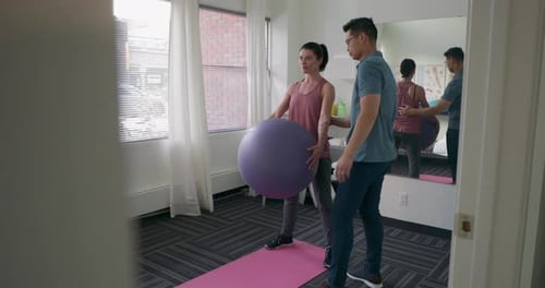 Woman Doing Core Exercises with Physical Therapist