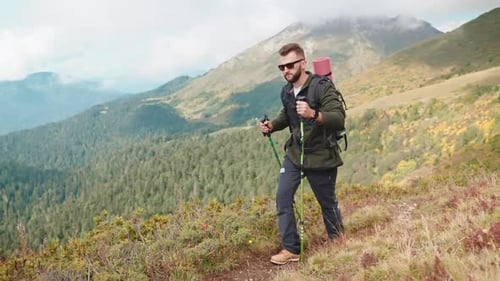 Traveller Climbing at Mountain Top Training His Endurance and Force Hiking in Mountains Alone