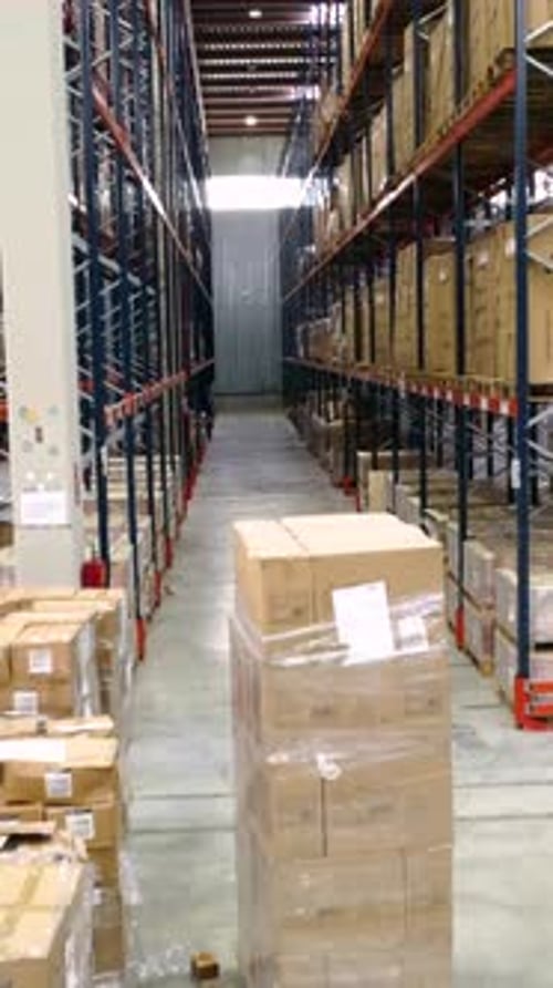 Warehouse worker scanning packages in logistics center