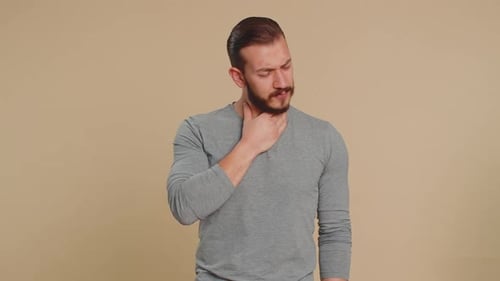 Man Coughing and Feeling Unwell in Studio