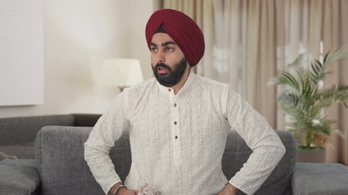 Sad Indian man counting money