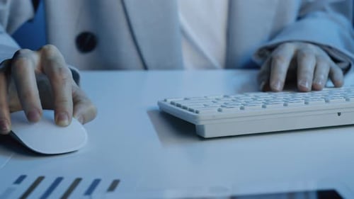 Unrecognizable Office Worker Typing on Keyboard