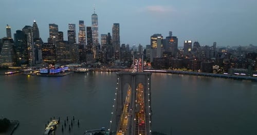 Brooklyn Bridge and Manhattan skyline at dusk, aerial view, New York City, USA