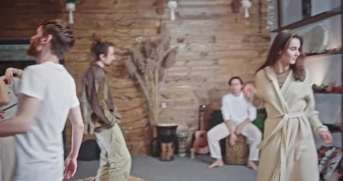 Cheerful People Dance Enjoying Traditional Music in Cafe