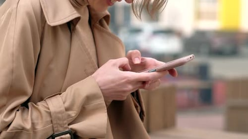 Woman Using Smartphone in the City