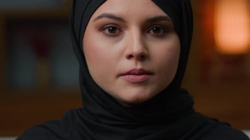 Close up Portrait of Woman in Black Headscarf