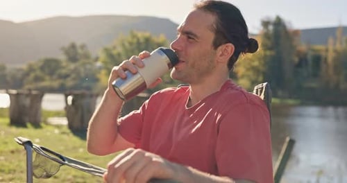 Camping, coffee and man relax at a lake or nature happy for holiday, adventure