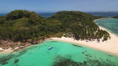 4K drone video flying backwards to reveal more of a beautiful tropical island in Palawan, Philippine