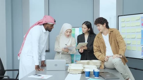 Diverse Colleagues Brainstorming in Modern Office Environment