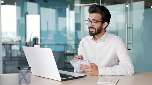 Young Professional Man on Video Call in Office
