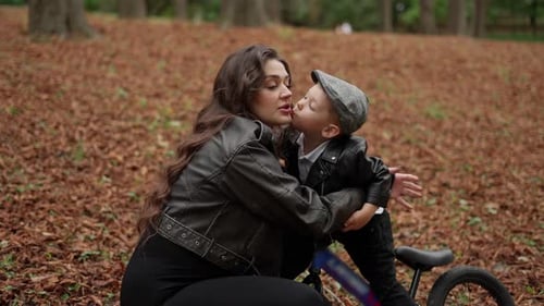 Loving Mother and Little Son in Autumn Park Concept of Maternal Love