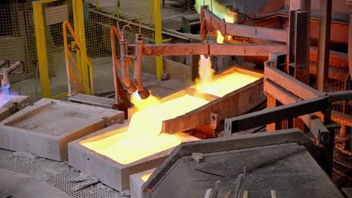 Molten Metal Flows Into Industrial Molds