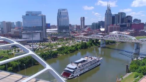 Nashville, TN / April 5, 2016: Ferry Heading Up Nashville River, Cityscape