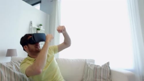 Enthusiastic man interacts with virtual reality headset